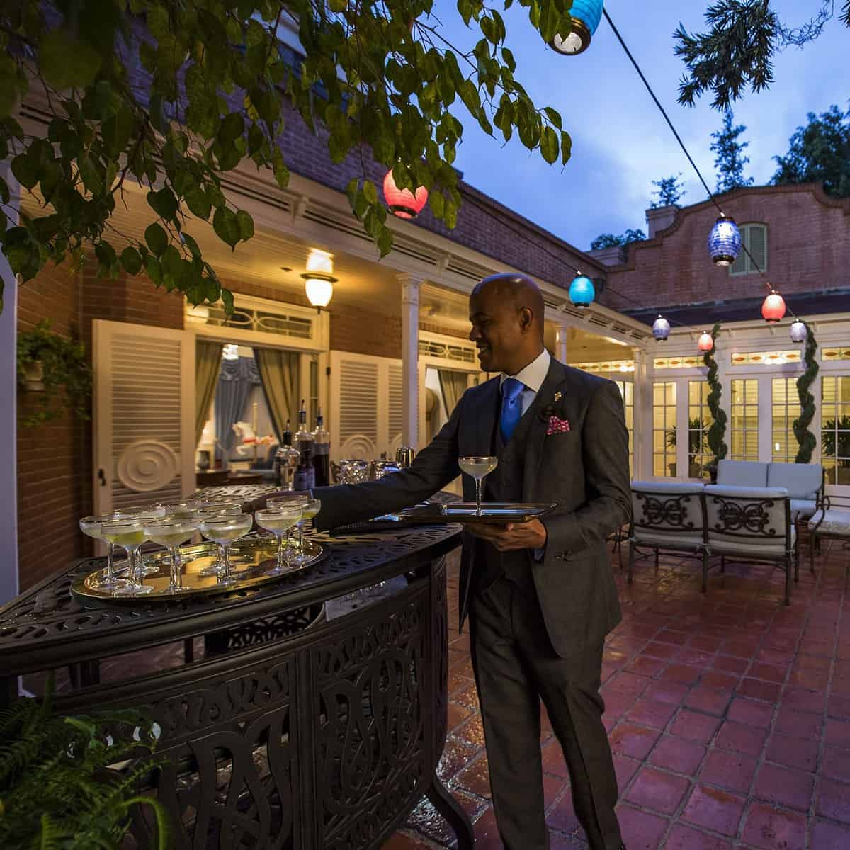 Legendary Disney service is on display from the moment guests are welcomed by the 21 Royal staff. Signature cocktails are served by professional butlers in the courtyard, then everyone is invited out to the patio for a casual reception.