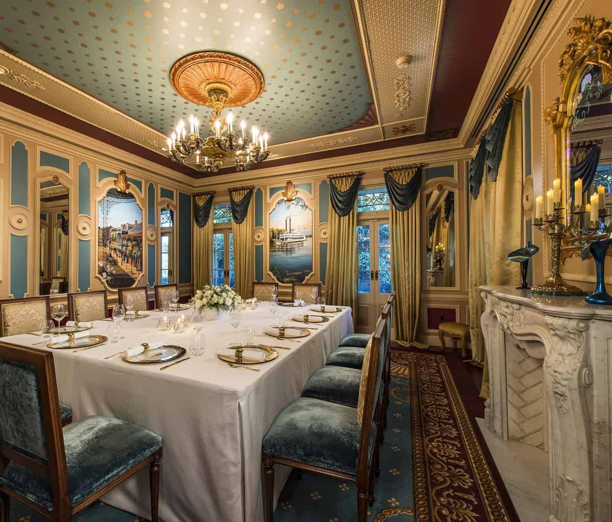 21 Royal is decorated in the Empire style made popular in 19th century New Orleans. At dinnertime, guests take their seats around a lavish table covered in white linens, fresh flowers and set with gold-plated dinnerware and fine crystal.